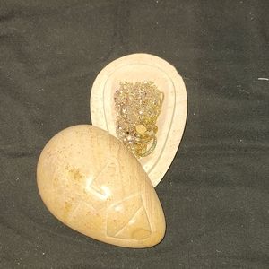 Stone carved jewelry box with jewelry